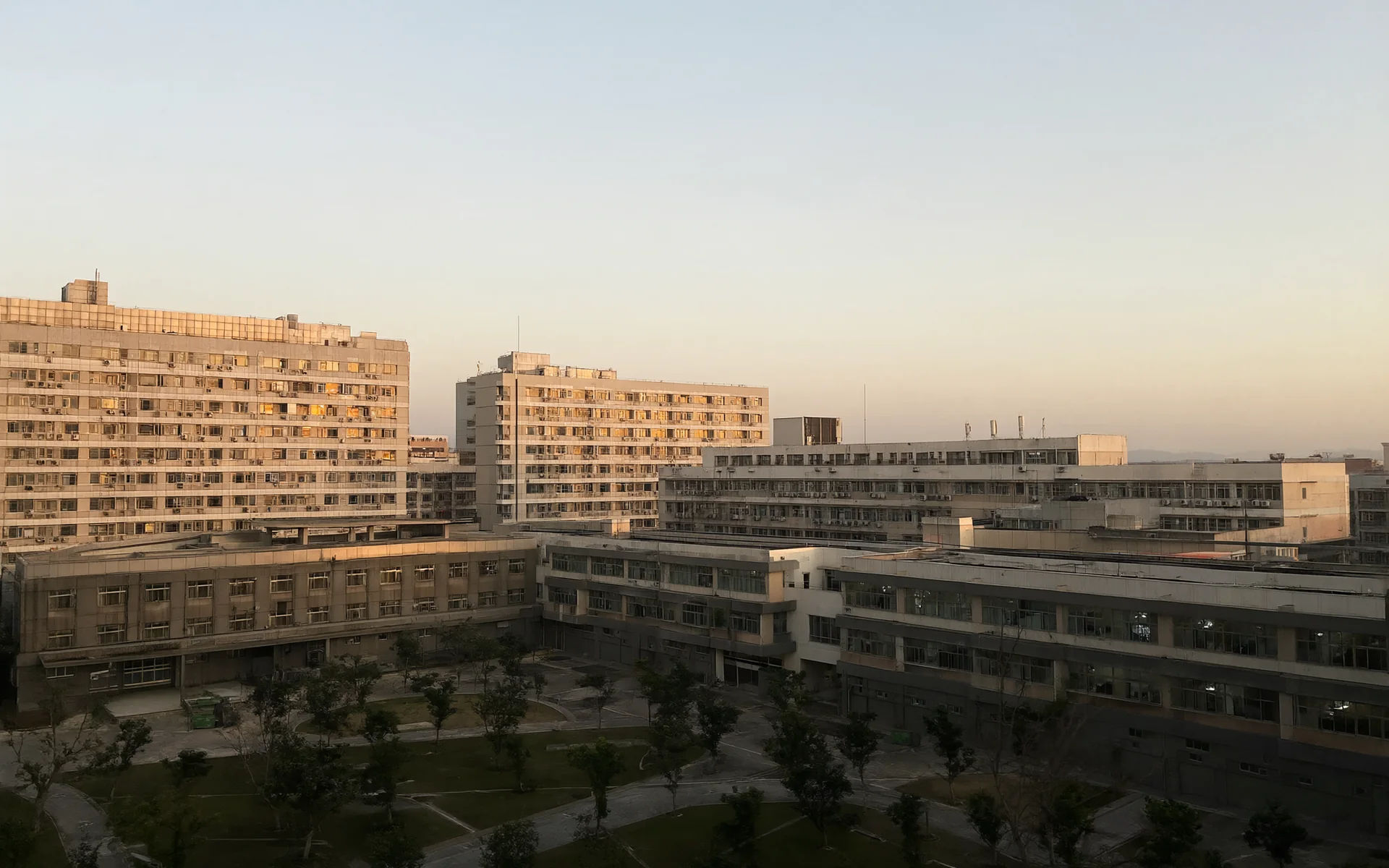 A large modern hospital campus at golden hour.