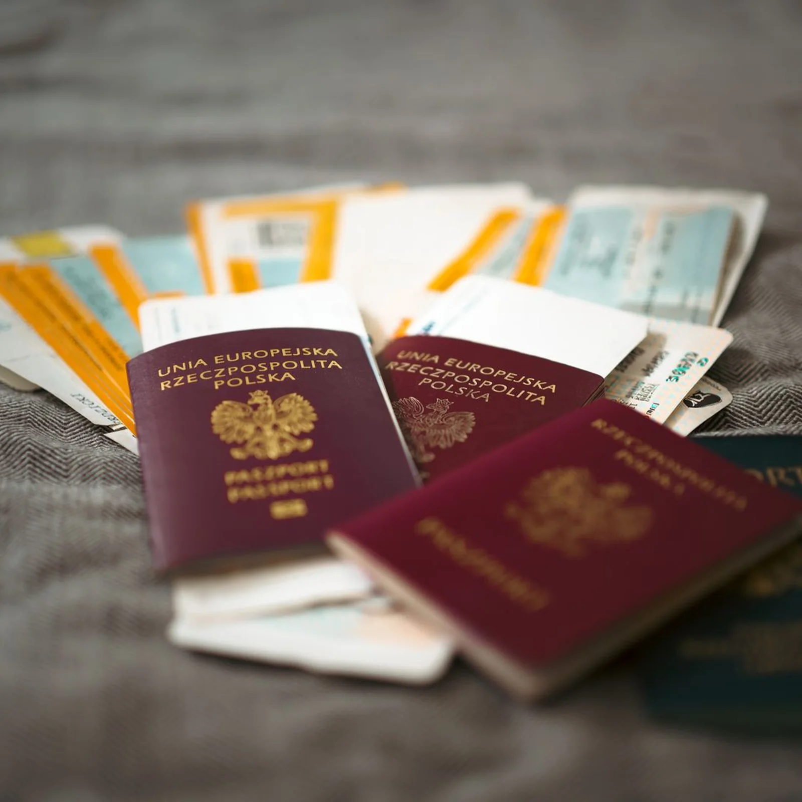 Passports and travel documents on a table.